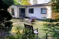 Achterkant chalet met tuin